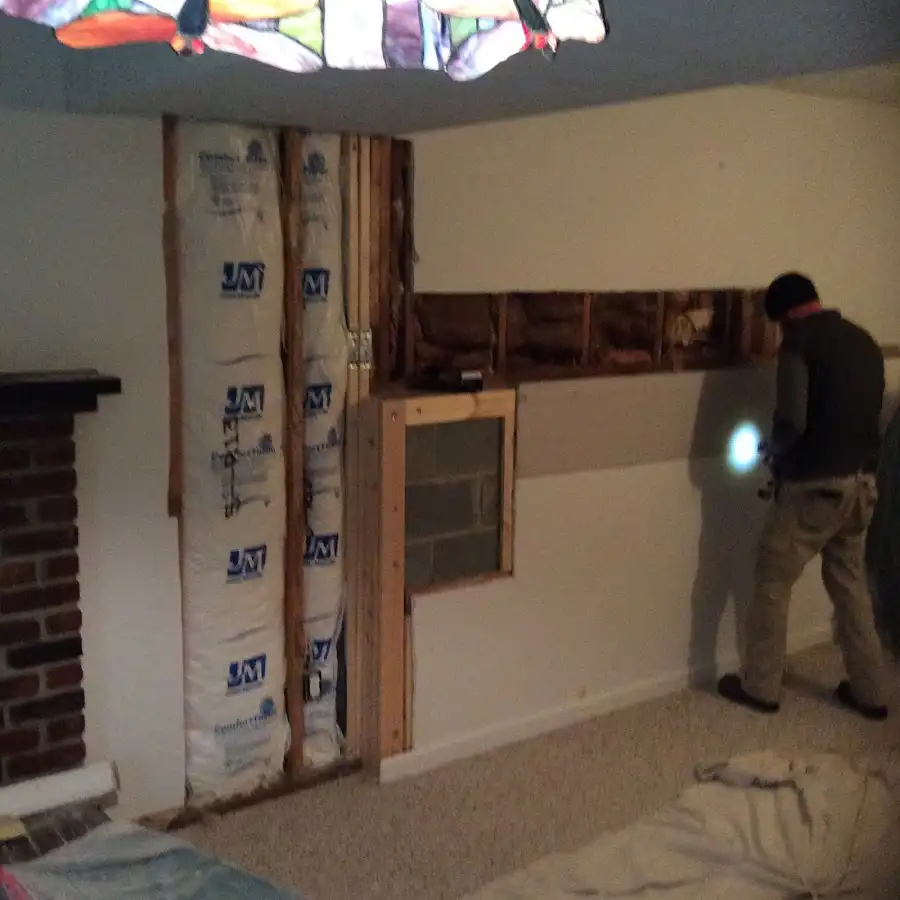 Restoration technician inspecting water damage in Suwanee